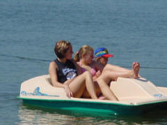 picture of family in paddle boat